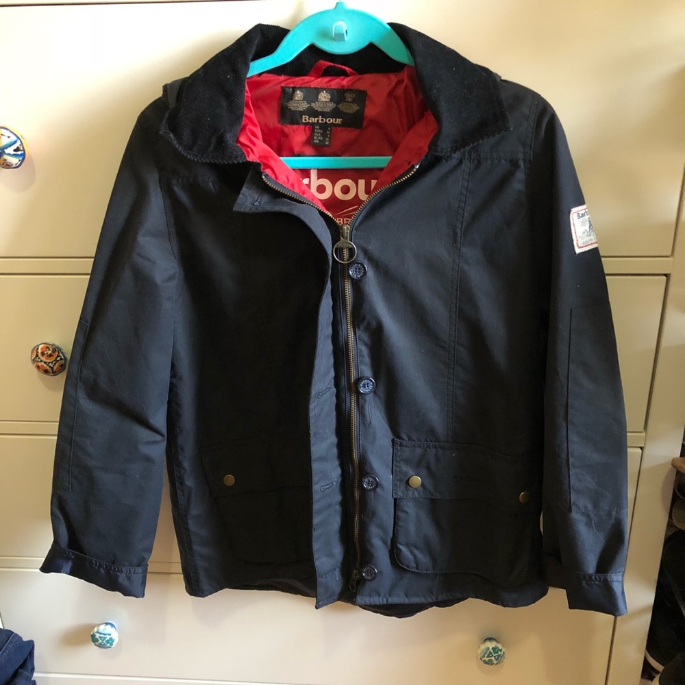 Navy Barbour jacket with red lining and hood